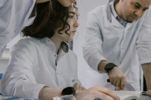 Scientists reviewing fake study footage of TV-deniers.